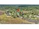 Aerial view showcasing the community's layout amidst lush greenery and waterfront scenery, with an indicator pin at 166 River Breeze Dr, Charleston, SC 29407