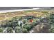 Overhead view of property showcases location in a community with lush greenery and water features at 166 River Breeze Dr, Charleston, SC 29407