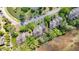 Aerial view of townhomes nestled among lush greenery, showcasing a well-maintained community with private parking at 166 River Breeze Dr, Charleston, SC 29407