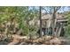 Tranquil backyard with elevated decks, lush greenery, and peaceful waterfront views at 166 River Breeze Dr, Charleston, SC 29407