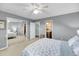 Bedroom with a mirrored closet, access to bathroom, and a serene blue and white color scheme at 166 River Breeze Dr, Charleston, SC 29407