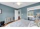 Bedroom features modern decor, a large closet with mirrored doors, and calming blue walls at 166 River Breeze Dr, Charleston, SC 29407