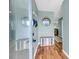 Inviting foyer with stylish decor, hardwood floors, and easy access to the rest of the home at 166 River Breeze Dr, Charleston, SC 29407