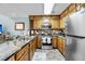 Spacious kitchen featuring stainless steel appliances, ample cabinetry, and adjacent living area at 166 River Breeze Dr, Charleston, SC 29407