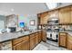 Well-equipped kitchen with stainless steel appliances, breakfast bar and ample counter space at 166 River Breeze Dr, Charleston, SC 29407