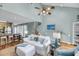 Open-concept living room with comfortable seating, ceiling fan and views of the kitchen at 166 River Breeze Dr, Charleston, SC 29407