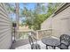 Outdoor patio with metal table and chairs offers scenic views of the waterway at 166 River Breeze Dr, Charleston, SC 29407