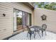 Outdoor patio with metal table and chairs offers a private setting for enjoying the outdoors at 166 River Breeze Dr, Charleston, SC 29407