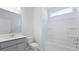 A bright bathroom with shower and tub combination and stylish vanity at 187 E Pinckney St, Summerville, SC 29485