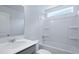 The bathroom has a modern vanity, a large mirror, and a shower-tub combo with a window at 187 E Pinckney St, Summerville, SC 29485
