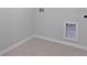 The laundry room has tile floors and hookups for a washer and dryer at 187 E Pinckney St, Summerville, SC 29485