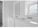 Bathroom featuring a double vanity with modern sinks, mirrors and updated lighting at 191 E Pinckney St, Summerville, SC 29485
