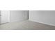 Neutral bedroom features gray carpeting and white trim for a clean, minimalist aesthetic at 191 E Pinckney St, Summerville, SC 29485