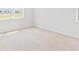 A bright bedroom with plush carpet and a large window for natural light at 191 E Pinckney St, Summerville, SC 29485