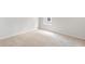 Bright bedroom features neutral carpet, fresh white walls, and natural light from the window at 191 E Pinckney St, Summerville, SC 29485