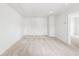 Large bonus room with plush carpet and a door leading to another room at 191 E Pinckney St, Summerville, SC 29485