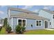 Exterior view features a patio and blue siding at 191 E Pinckney St, Summerville, SC 29485