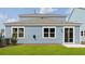 Rear exterior view features a patio and blue siding at 191 E Pinckney St, Summerville, SC 29485
