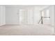 Open hallway with carpet flooring, white walls and staircase with railing at 191 E Pinckney St, Summerville, SC 29485