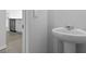 Powder room featuring a pedestal sink and stylish design for added convenience at 191 E Pinckney St, Summerville, SC 29485