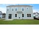 A well-maintained, two-story home exterior with a lush green lawn and classic light-blue siding at 199 E Pinckney St, Summerville, SC 29485