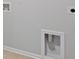 Basement with connections for washer and dryer, and a utility hookup framed in white at 199 E Pinckney St, Summerville, SC 29485