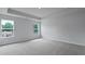 Spacious bedroom featuring light walls, neutral carpet, and natural lighting at 199 E Pinckney St, Summerville, SC 29485