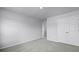 A clean, carpeted bedroom featuring a closet with double doors and a view into an adjoining space at 199 E Pinckney St, Summerville, SC 29485
