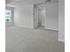 Bright bedroom with light walls, neutral carpet, and a door to the hallway at 199 E Pinckney St, Summerville, SC 29485
