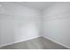 A walk-in closet with wire shelving, offering ample storage space, and neutral carpet at 199 E Pinckney St, Summerville, SC 29485