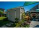 Backyard shed for extra storage, complemented by a cozy patio area and privacy fence at 208 Waterford Ln, Summerville, SC 29483