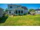 Spacious backyard featuring lush grass, a patio, and a charming shed at 208 Waterford Ln, Summerville, SC 29483