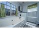 Bright bathroom featuring a large soaking tub and window at 208 Waterford Ln, Summerville, SC 29483