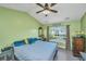 Bright bedroom featuring a high ceiling, ceiling fan, and a window view at 208 Waterford Ln, Summerville, SC 29483