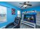 Bright bedroom with a bunk bed, gaming chair, and natural light with a ceiling fan at 208 Waterford Ln, Summerville, SC 29483