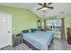 Bedroom boasts natural light, ceiling fan, green walls, with a window and view at 208 Waterford Ln, Summerville, SC 29483