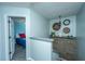 Hallway leading to a bedroom features stylish decor, stairwell, and lots of natural light at 208 Waterford Ln, Summerville, SC 29483