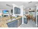 Modern kitchen with granite countertops, stainless steel appliances, and an open layout to the dining area at 208 Waterford Ln, Summerville, SC 29483