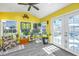 Bright sunroom with vaulted ceilings, natural light, multiple windows, and access to the outdoor living spaces at 208 Waterford Ln, Summerville, SC 29483