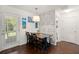 Cozy dining area with wood floors, decorative wall, and modern light fixture at 214 Blackstone Dr, Moncks Corner, SC 29461