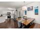 Open floor plan showcases kitchen, dining area with rustic table and decor at 214 Blackstone Dr, Moncks Corner, SC 29461