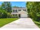 Charming two-story home features a long driveway, one car garage and well-maintained lawn surrounded by mature trees at 214 Blackstone Dr, Moncks Corner, SC 29461