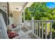 Inviting front porch with rocking chairs and a view of the green landscape at 214 Blackstone Dr, Moncks Corner, SC 29461