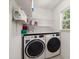 Functional laundry room with washer, dryer, and ample storage space at 214 Blackstone Dr, Moncks Corner, SC 29461