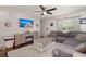 Cozy living room with a gray sectional, fireplace, ceiling fan and white rug creating a comfortable and inviting space at 214 Blackstone Dr, Moncks Corner, SC 29461