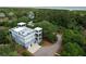 Stunning coastal home boasts rooftop deck, manicured landscaping, and private driveway near the beach at 2213 Rolling Dune Rd, Seabrook Island, SC 29455