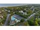 An aerial view of a coastal community with a pool, parking, and access to the nearby beach at 2213 Rolling Dune Rd, Seabrook Island, SC 29455