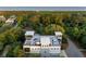 Aerial view of a multi-level home with rooftop deck, offering ocean views and resort style ammenities at 2213 Rolling Dune Rd, Seabrook Island, SC 29455