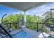 Stylish outdoor seating on this porch, perfect for enjoying the garden view at 2213 Rolling Dune Rd, Seabrook Island, SC 29455