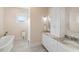 Elegant bathroom features a soaking tub, walk-in shower, and dual marble vanity at 2213 Rolling Dune Rd, Seabrook Island, SC 29455